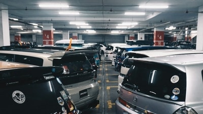 Bengaluru’s housing societies struggle with limited parking availability and rising car ownership, the cost of securing an extra parking slot is becoming a growing concern for residents in the city’s large gated communities. (Photo for representational purposes only) (Unsplash)
