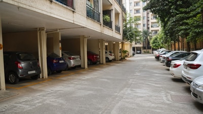 Residents should know that parking in housing complexes is typically classified as open, covered, or stilt parking, and ownership or allocation depends on sale agreements and approved building plans. (Picture fore representational purposes only) (AI generated image using ChatGPT)